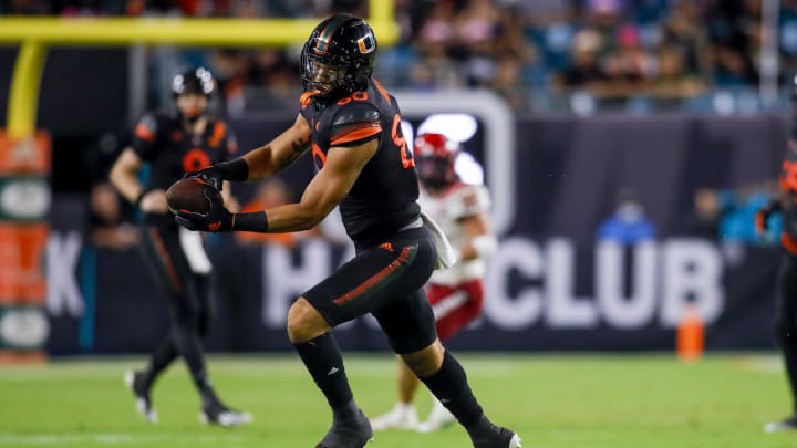 Oct 23, 2021; Miami Gardens, Florida, USA; Miami Hurricanes tight end Elijah Arroyo (80) catches the football against the North Carolina State Wolfpack during the second half of the game at Hard Rock Stadium. Mandatory Credit: Sam Navarro-USA TODAY Sports