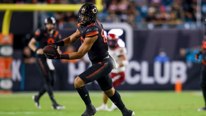 Oct 23, 2021; Miami Gardens, Florida, USA; Miami Hurricanes tight end Elijah Arroyo (80) catches the football against the North Carolina State Wolfpack during the second half of the game at Hard Rock Stadium. Mandatory Credit: Sam Navarro-USA TODAY Sports