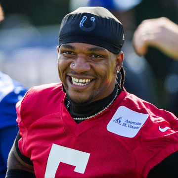 Indianapolis Colts quarterback Anthony Richardson (5) smiles while warming up Saturday, July 27, 2024, during the Indianapolis Colts’ training camp at Grand Park Sports Complex in Westfield.