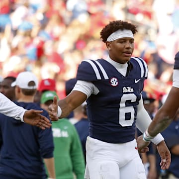 Nov 8, 2025; Oxford, Mississippi, USA; Mississippi Rebels quarterback Trinidad Chambliss (6) reacts with quarterback Austin Simmons (13) during the fourth quarter against The Citadel Bulldogs at Vaught-Hemingway Stadium. Mandatory Credit: Petre Thomas-Imagn Images