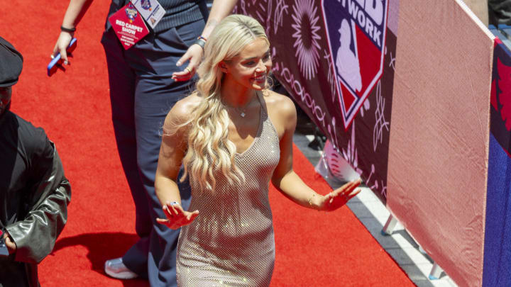 Jul 16, 2024; Arlington, Texas, USA; National League pitcher Paul Skenes of the Pittsburgh Pirates walks the red carpet with his girlfriend LSU gymnast Olivia Livvy Dunne before the 2024 MLB All-Star game at Globe Life Field. 