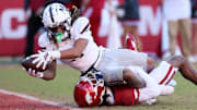 Mississippi State Bulldogs wide receiver Anthony Evans III (3) scores a touchdown during the third quarter against the Arkansas Razorbacks at Donald W. Reynolds Razorback Stadium. Bulldogs won 38-35.