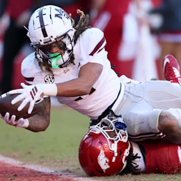Mississippi State Bulldogs wide receiver Anthony Evans III (3) scores a touchdown during the third quarter against the Arkansas Razorbacks at Donald W. Reynolds Razorback Stadium. Bulldogs won 38-35.