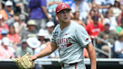 Arkansas Razorbacks starting pitcher Gage Wood (14) looks at the scoreboard walking off the mound after the end of the third inning against the Murray State Racers at Charles Schwab Field.