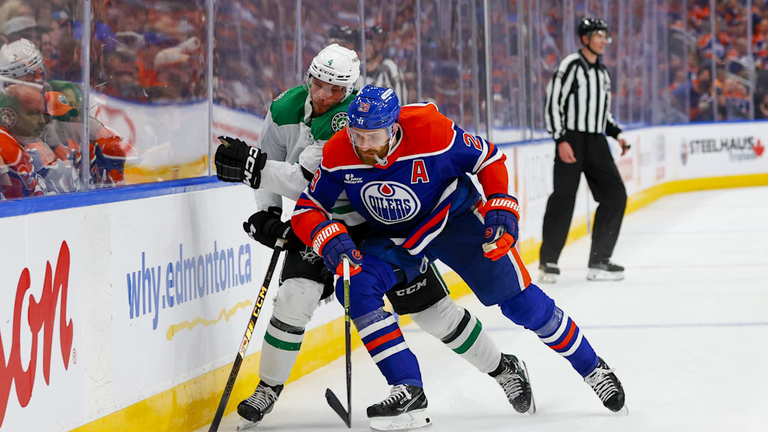 Edmonton Oilers center Leon Draisaitl (29) checks Dallas Stars defenseman Miro Heiskanen (4) 
