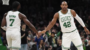 Apr 21, 2024; Boston, Massachusetts, USA; Boston Celtics center Al Horford (42) is congratulated by guard Jaylen Brown (7) after a basket during the second half in game one of the first round for the 2024 NBA playoffs against the Miami Heat at TD Garden. Mandatory Credit: Bob DeChiara-Imagn Images