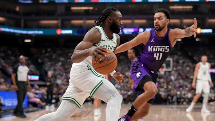 Mar 24, 2025; Sacramento, California, USA; Boston Celtics forward Jaylen Brown (7) dribbles past Sacramento Kings forward Trey Lyles (41) in the second quarter at the Golden 1 Center. Mandatory Credit: Cary Edmondson-Imagn Images Mar 24, 2025; Sacramento, California, USA; Boston Celtics forward Jaylen Brown (7) dribbles past Sacramento Kings forward Trey Lyles (41) in the second quarter at the Golden 1 Center. Mandatory Credit: Cary Edmondson-Imagn Images