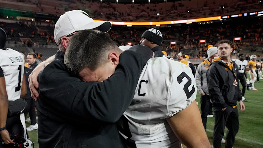 Vanderbilt senior advisor Jerry Kill embraces Commodores quarterback Diego Pavia.,