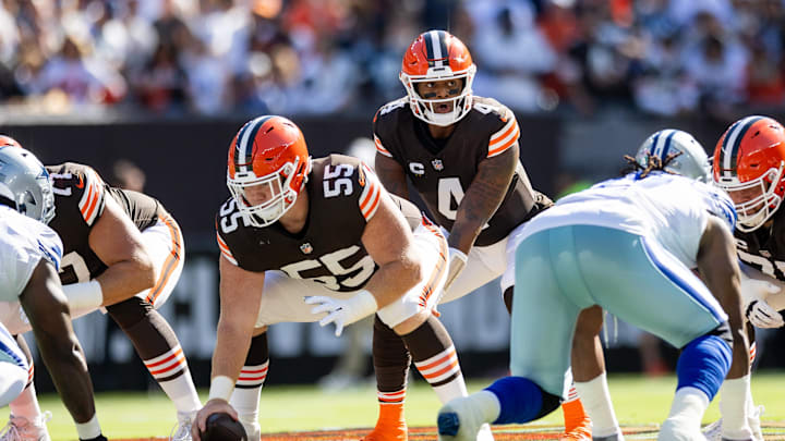 Sep 8, 2024; Cleveland, Ohio, USA; Cleveland Browns quarterback Deshaun Watson (4) lines up under center Ethan Pocic (55) against the Dallas Cowboys during the first quarter at Huntington Bank Field. Mandatory Credit: Scott Galvin-Imagn Images