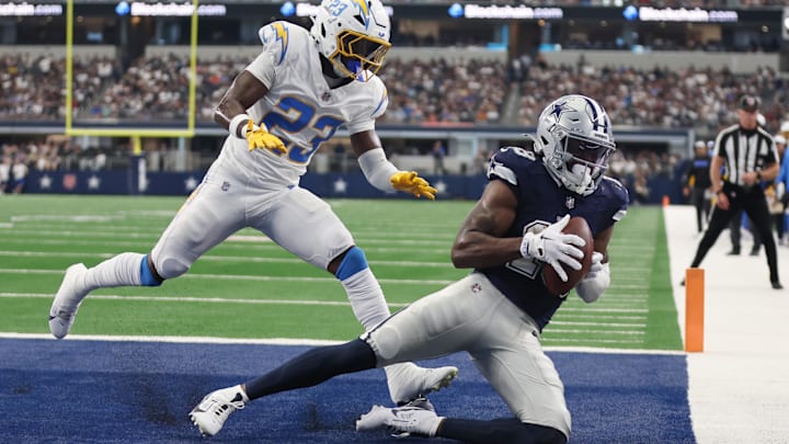 =Dallas Cowboys wide receiver Ryan Flournoy catches a touchdown pass against Los Angeles Chargers cornerback Matt Hankins.