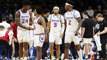 Feb 24, 2025; Boulder, Colorado, USA; Kansas Jayhawks forward KJ Adams Jr. (24), guard David Coit (8),guard Dajuan Harris Jr. (3), and guard AJ Storr (2) during the second half against the Colorado Buffaloes at the CU Events Center. Mandatory Credit: Ron Chenoy-Imagn Images
