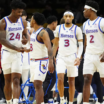 Feb 24, 2025; Boulder, Colorado, USA; Kansas Jayhawks forward KJ Adams Jr. (24), guard David Coit (8),guard Dajuan Harris Jr. (3), and guard AJ Storr (2) during the second half against the Colorado Buffaloes at the CU Events Center. Mandatory Credit: Ron Chenoy-Imagn Images