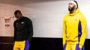 Apr 14, 2024; New Orleans, Louisiana, USA;  Los Angeles Lakers forward LeBron James (23) and forward Anthony Davis (3) look on from the tunnel before the first half against the New Orleans Pelicans at Smoothie King Center. Mandatory Credit: Stephen Lew-USA TODAY Sports