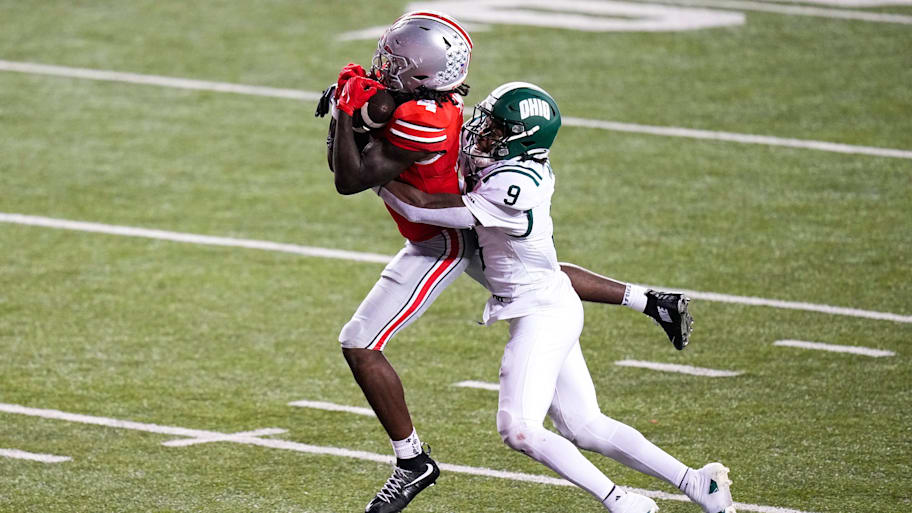 Ohio State wide receiver Jeremiah Smith catches a pass against Ohio cornerback Michael Mack II.