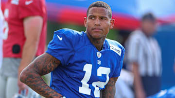 Aug 1, 2023; East Rutherford, NJ, USA; New York Giants tight end Darren Waller (12) stretches during training camp at the Quest Diagnostics Training Facility.  Mandatory Credit: Vincent Carchietta-Imagn Images