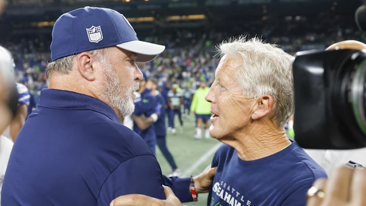 Aug 19, 2023; Seattle, Washington, USA; Dallas Cowboys head Coach Mike McCarthy, left, greets Seattle Seahawks head coach Pete Carroll following a 22-14 Seattle victory at Lumen Field. Mandatory Credit: Joe Nicholson-Imagn Images