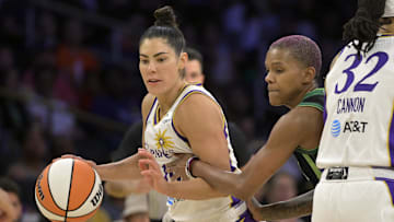Jul 10, 2025; Los Angeles, California, USA;  Los Angeles Sparks guard Kelsey Plum (10) drives past Minnesota Lynx guard Courtney Williams (10) in the second half at Crypto.com Arena. Mandatory Credit: Jayne Kamin-Oncea-Imagn Images
