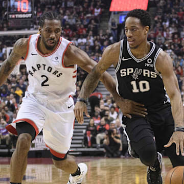 San Antonio Spurs guard DeMar DeRozan (10) and Toronto Raptors forward Kawhi Leonard (2) at Scotiabank Arena. 