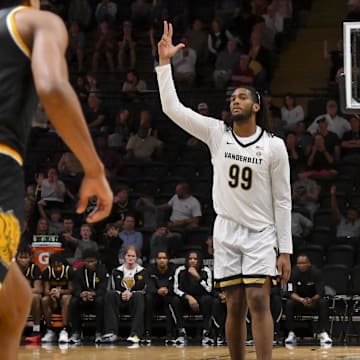 Nov 15, 2025; Nashville, Tennessee, USA;  Vanderbilt Commodores forward Devin McGlockton (99) reacts after a made three point basket  against the Arkansas-Pine Bluff Golden Lions during the second half at Memorial Gymnasium. Mandatory Credit: Steve Roberts-Imagn Images