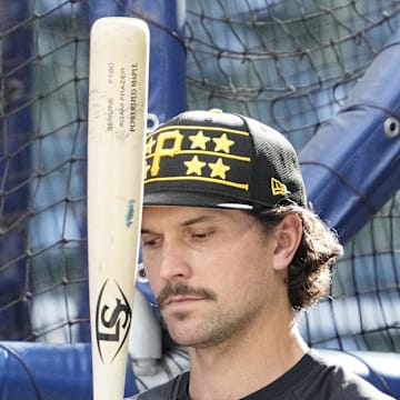 Pittsburgh Pirates second base Adam Frazier (26) gets ready to take some at bats during batting practice before a game against the Milwaukee Brewers at American Family Field in 2025. 