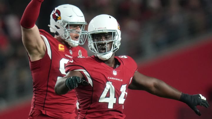 Dec 25, 2022; Glendale, Arizona, USA; Arizona Cardinals linebacker Markus Golden (44) and J.J. Watt (99) celebrate a stop on third down against the Tampa Bay Buccaneers at State Farm Stadium. Mandatory Credit: Joe Rondone-USA TODAY Sports