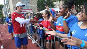 Bills quarterbacks Josh Allen runs around the entire practice field high-fiving and fist-bumping fans at the end of the opening day of Buffalo Bills training camp.