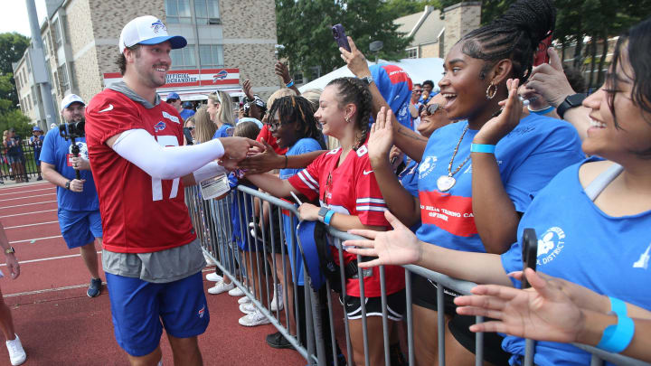 Bills quarterbacks Josh Allen runs around the entire practice field high-fiving and fist-bumping fans at the end of the opening day of Buffalo Bills training camp.