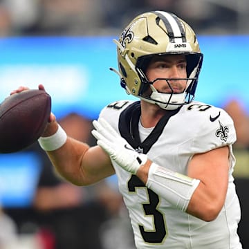 New Orleans Saints quarterback Jake Haener throws a pass.