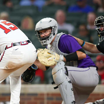 Atlanta Braves second baseman Whit Merrifield is hit in the head with a pitch against the Colorado Rockies.