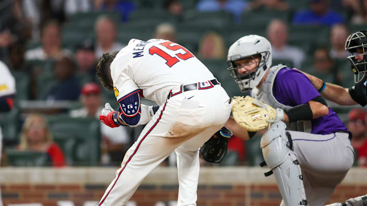 Atlanta Braves second baseman Whit Merrifield is hit in the head with a pitch against the Colorado Rockies.