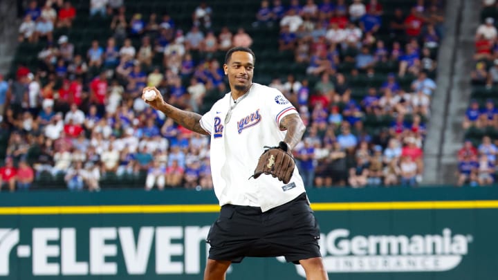 Jul 24, 2024; Arlington, Texas, USA; Dallas Mavericks forward P.J. Washington throws out the first pitch before the game between the Texas Rangers and Chicago White Sox at Globe Life Field. Mandatory Credit: Kevin Jairaj-USA TODAY Sports