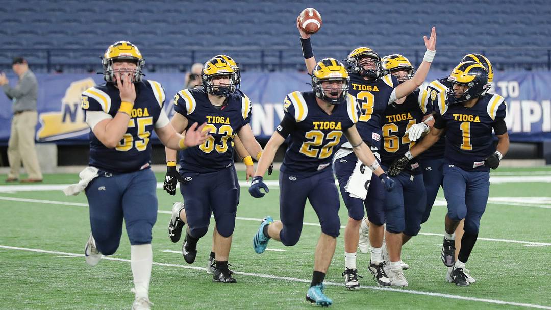 Tioga celebrated its 42-31 win over Tuckahoe in the New York State Class D football championship game on Dec. 5, 2025, at the JMA Wireless Dome in Syracuse.