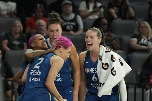 Minnesota Lynx guard Courtney Williams, forwards Jessica Shepard  and Bridget Carleton celebrate a block by Natisha Hiedeman.