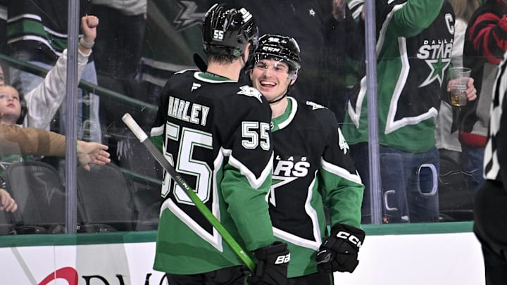 Dec 21, 2025; Dallas, Texas, USA; Dallas Stars defenseman Thomas Harley (55) and center Justin Hryckowian (49) celebrates a goal scored by Hryckowian against the Toronto Maple Leafs during the third period at the American Airlines Center. Mandatory Credit: Jerome Miron-Imagn Images
