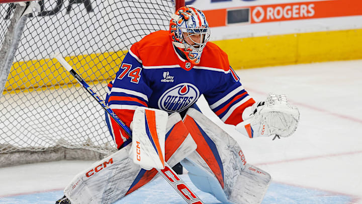 Oct 8, 2025; Edmonton, Alberta, CAN; Edmonton Oilers goaltender Stuart Skinner (74) makes a save during warmup against the Calgary Flames at Rogers Place. Mandatory Credit: Perry Nelson-Imagn Images
