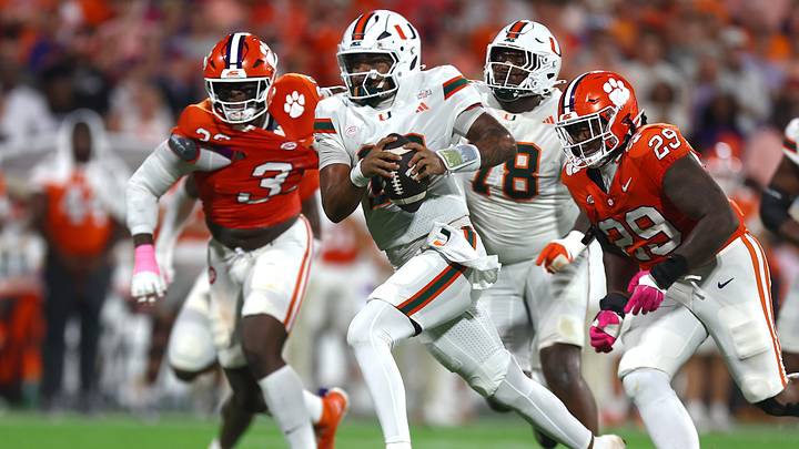 Oct 3, 2026; Clemson, South Carolina, USA;  Miami Hurricanes quarterback Darian Mensah (10) runs the ball during the second quarter for a touchdown against the Clemson Tigers at Memorial Stadium.  Mandatory Credit: Ashley Tumlin-Imagn Images