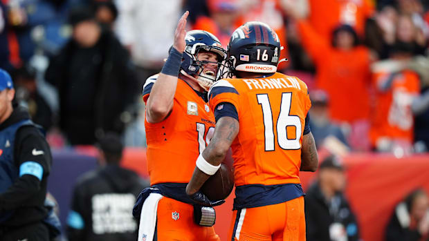 Nov 17, 2024; Denver, Colorado, USA; Denver Broncos wide receiver Troy Franklin (16) celebrates his touchdown with quarterbac