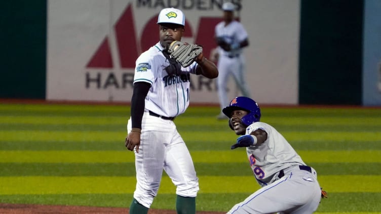 Cincinnati Reds prospect Ivan Johnson makes the tag at second base.