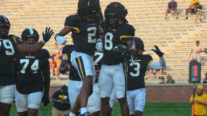 Aug. 17, 2024: Columbia, Missouri; Missouri Tigers wide receiver Marquis Johnson (2) and running back Nate Noel (8) celebrate at the team's annual fan night practice at Faurot Field.