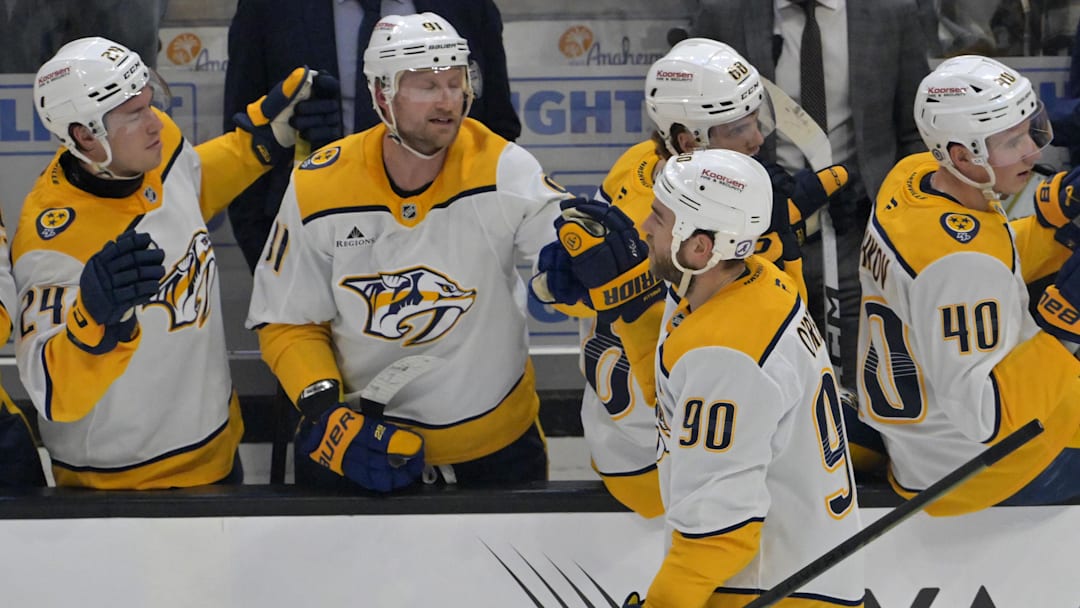 Jan 25, 2025; Anaheim, California, USA; Nashville Predators center Ryan O'Reilly (90) is congratulated at the bench after scoring a goal in the second period against the Anaheim Ducks at Honda Center. Mandatory Credit: Jayne Kamin-Oncea-Imagn Images