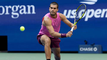 Carloa Alcaraz prepares to hit a backhand during the U.S. Open semifinals.