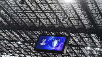 The Champions League trophy and the competition logo are...