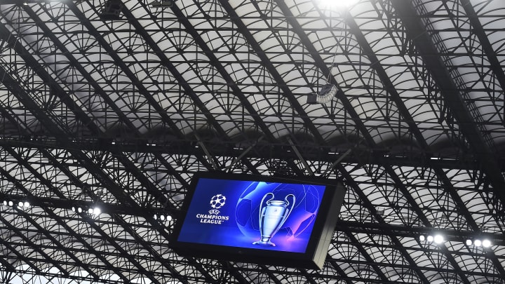 The Champions League trophy and the competition logo are... The Champions League trophy and the competition logo are...