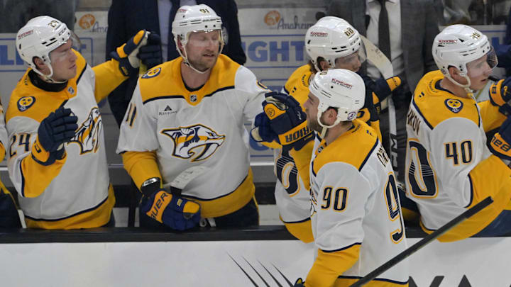 Jan 25, 2025; Anaheim, California, USA; Nashville Predators center Ryan O'Reilly (90) is congratulated at the bench after scoring a goal in the second period against the Anaheim Ducks at Honda Center. Mandatory Credit: Jayne Kamin-Oncea-Imagn Images