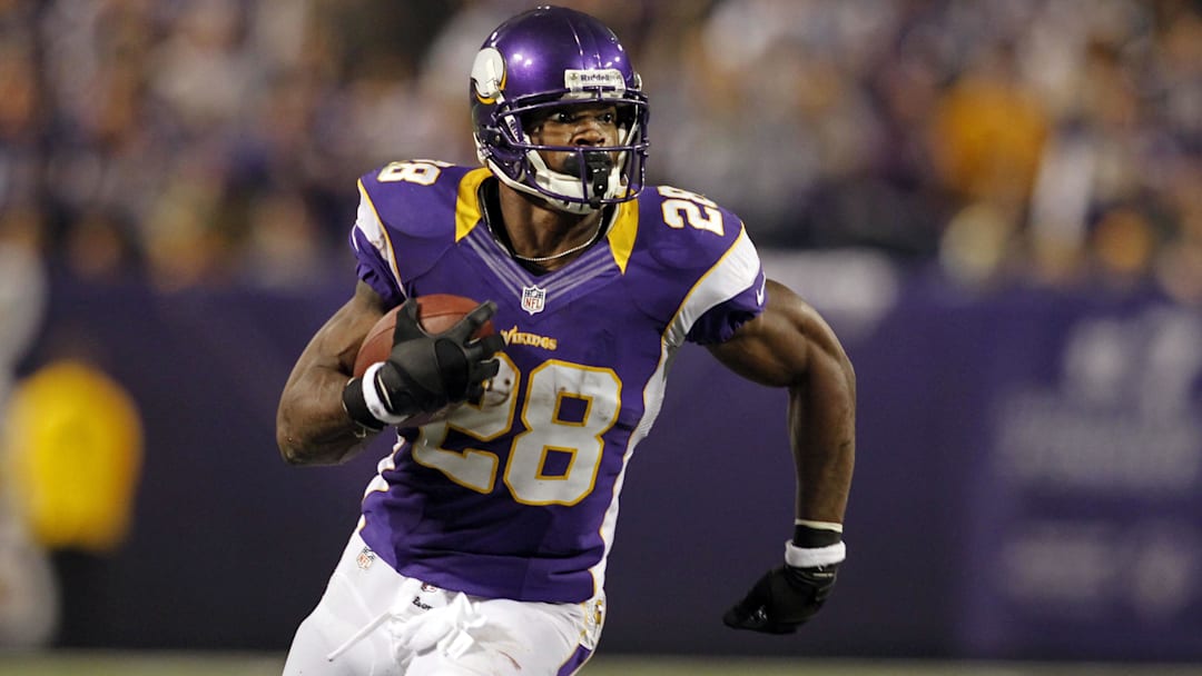 Dec 30, 2012; Minneapolis, MN, USA; Minnesota Vikings running back Adrian Peterson (28) rushes against the Green Bay Packers in the second quarter at the Metrodome.