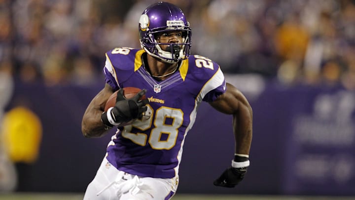 Dec 30, 2012; Minneapolis, MN, USA; Minnesota Vikings running back Adrian Peterson (28) rushes against the Green Bay Packers in the second quarter at the Metrodome. Dec 30, 2012; Minneapolis, MN, USA; Minnesota Vikings running back Adrian Peterson (28) rushes against the Green Bay Packers in the second quarter at the Metrodome.