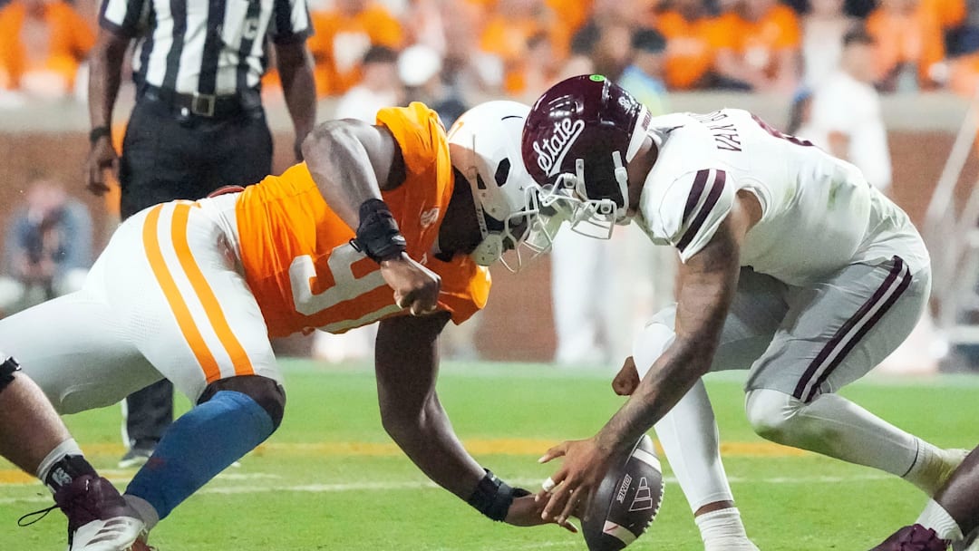 Tennessee defensive lineman Jayson Jenkins (97) forces Mississippi State quarterback Michael Van Buren Jr. (0) try to fumble the ball during a college football game between Tennessee and Mississippi State at Neyland Stadium in Knoxville, Tenn., on Saturday, Nov. 9, 2024.