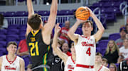 Nov 25, 2024; Fort Meyers, FL, USA; Miami (OH) Redhawks forward Kam Craft (4) shoots the ball over Siena Saints forward Brendan Coyle (21) in the second half  at Suncoast Credit Union Arena. Mandatory Credit: Nathan Ray Seebeck-Imagn Images