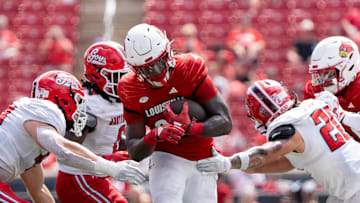 Louisville Cardinals running back Keyjuan Brown (22) rushes down the field through the Austin Peay Governors defensive line during their game against the Austin Peay Governors on Saturday, Aug. 31, 2024 at L&N Federal Credit Union Stadium in Louisville, Ky.