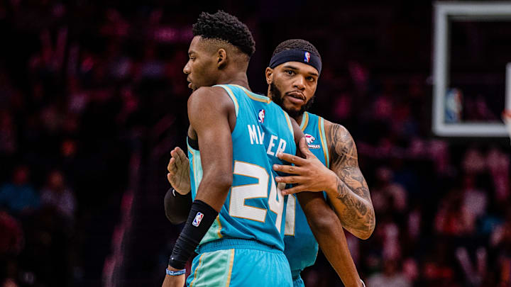 Apr 7, 2024; Charlotte, North Carolina, USA; Charlotte Hornets forward Miles Bridges (0) congratulates forward Brandon Miller (24) during a game against the Oklahoma City Thunder at Spectrum Center. Mandatory Credit: Scott Kinser-Imagn Images